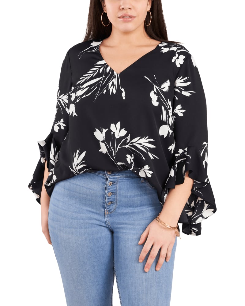 Front of a model wearing a size 1X Winona Flutter Sleeve Tunic Blouse in Rich Black by Vince Camuto. | dia_product_style_image_id:261869